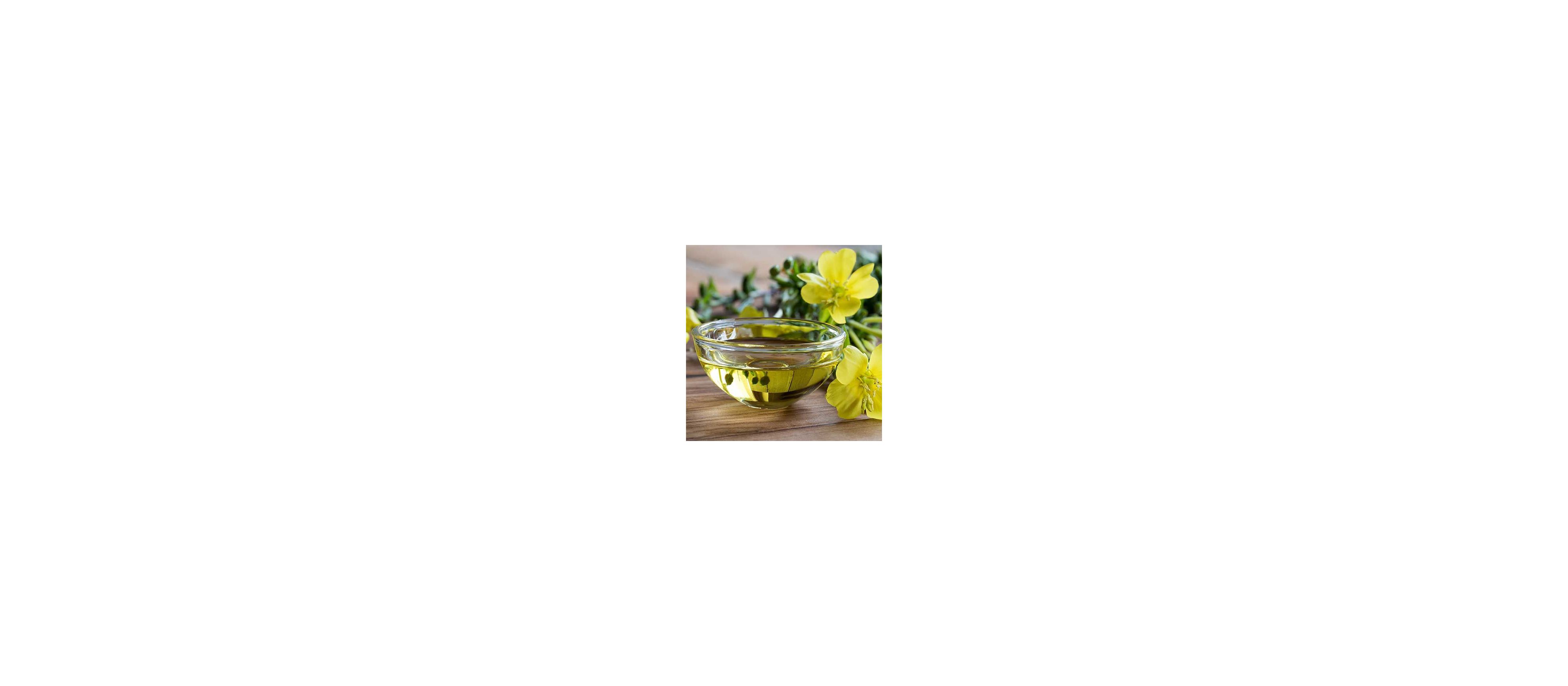 A bowl of evening primrose oil next to evening primrose flowers