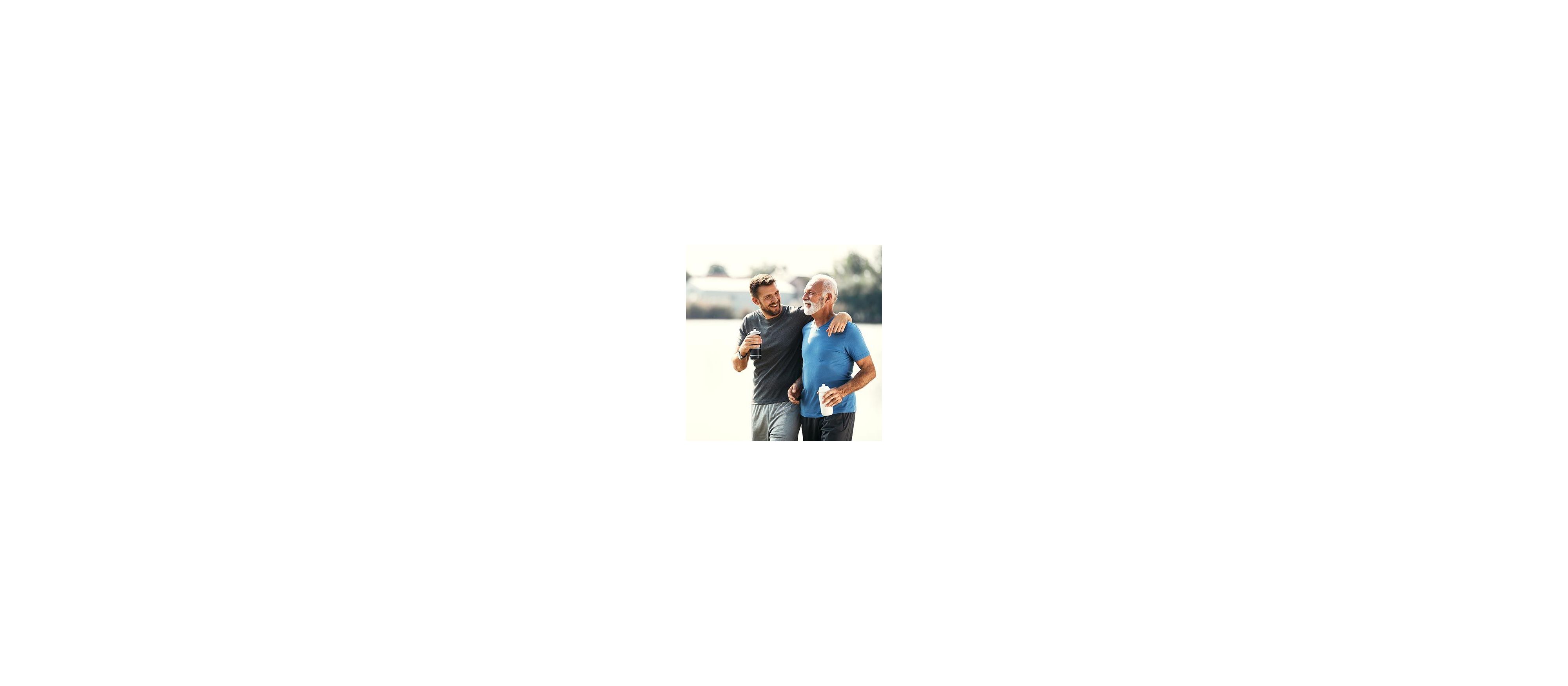 Two adult men, father and son, are outside exercising