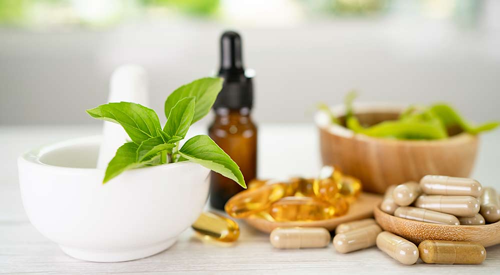 A collection of different dietary supplements in capsules, gel capsules and liquid form