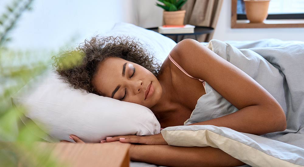 Woman sleeping well in bed