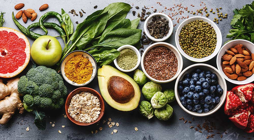 A table rich in food such as seeds, nuts, berries and vegetables