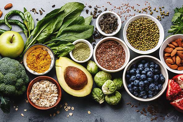 A table rich in food such as seeds, nuts, berries and vegetables