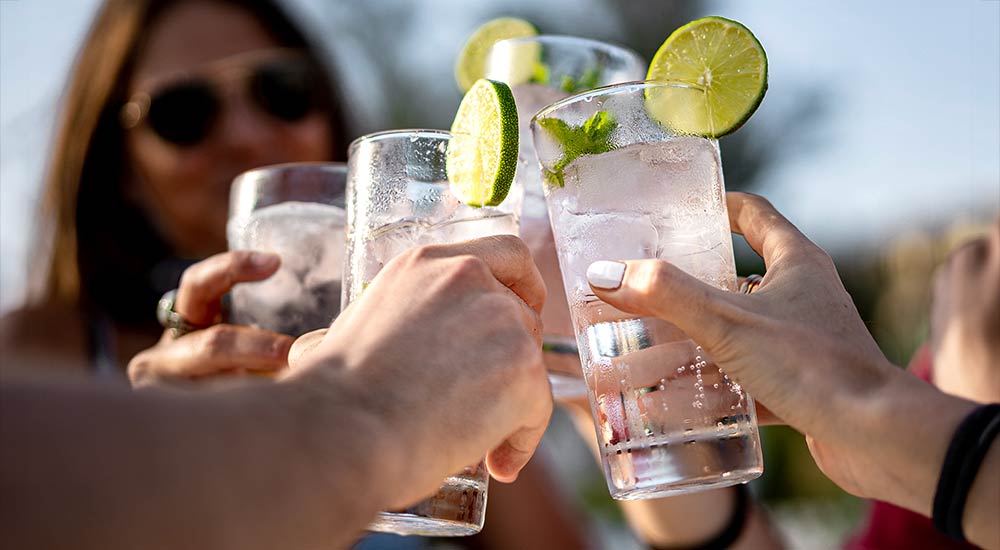 Happy people toast with mocktails