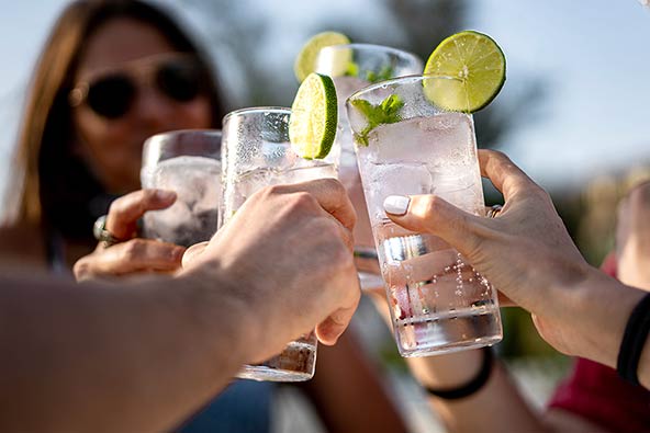 Happy people toast with mocktails